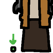 a small green dot with a green arrow pointing to it. there is a person next to it, although their head is cropped out of frame. the dot is about half the size of their hand. the person is wearing a brown skirt, a dull orange cardigan and a cream shirt. they have long wavy salt and pepper hair